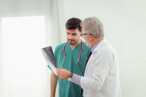 physician assistant working with a doctor
