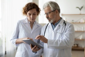 physician’s assistant working with a doctor