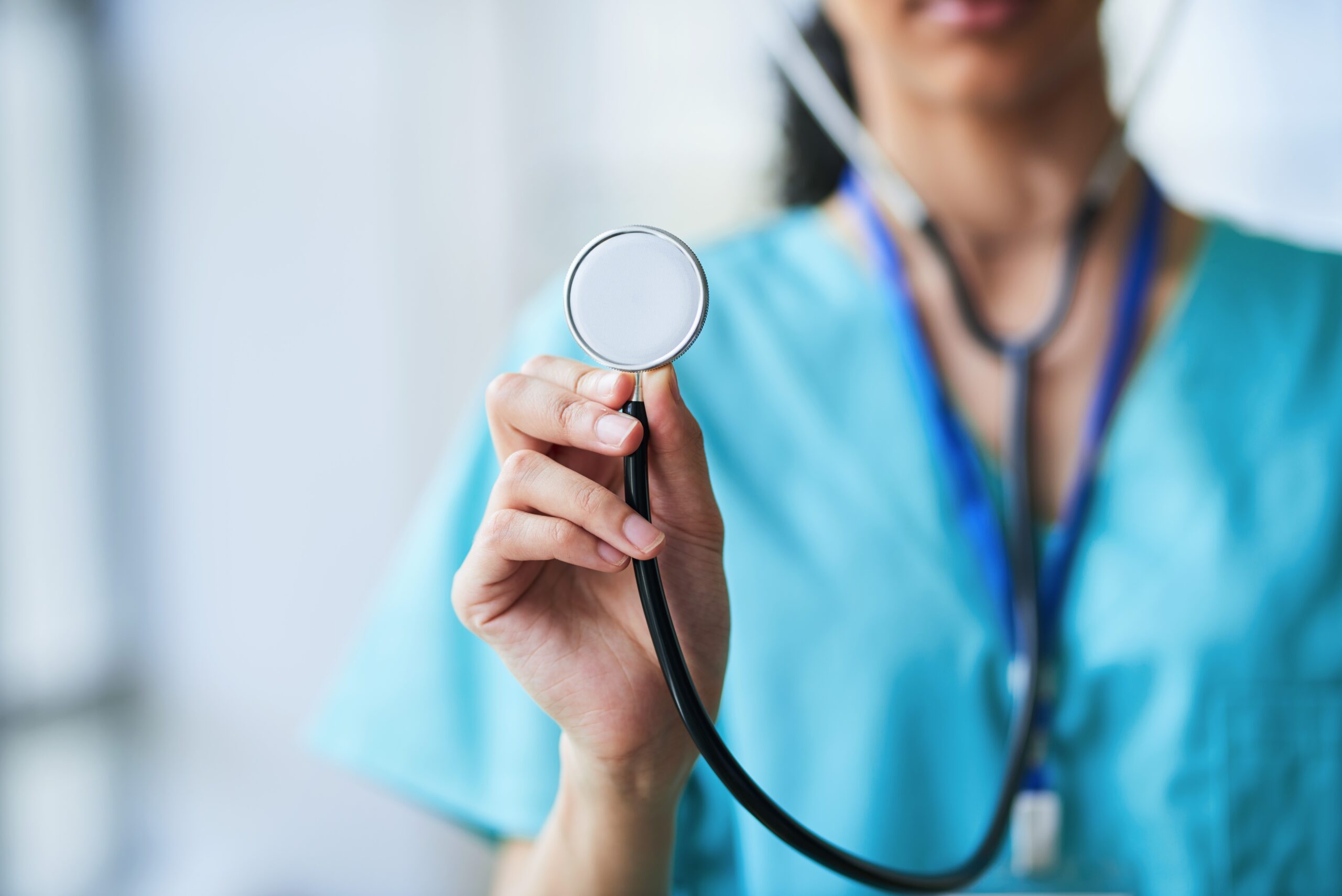 Close-up of a physician assistant holding a stethoscope